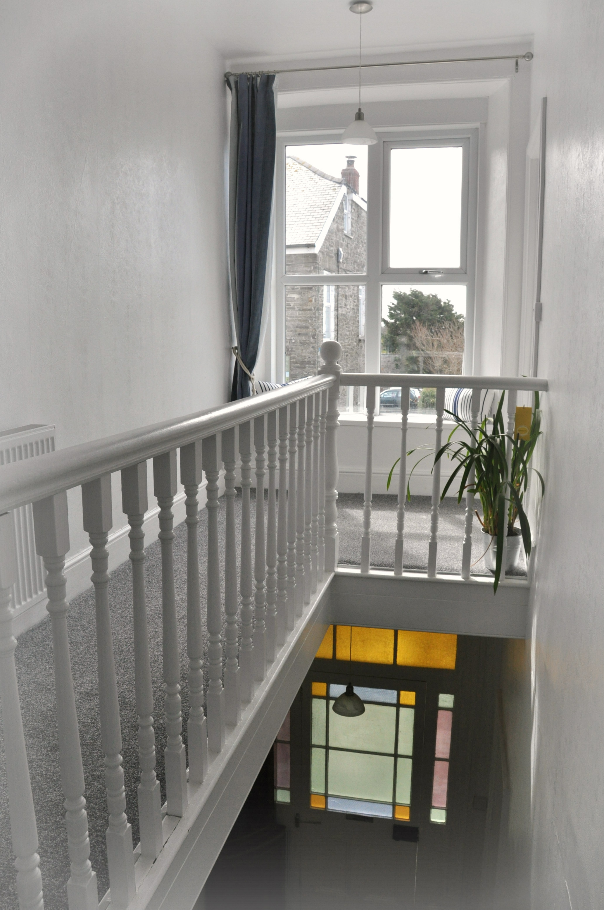 Landing area with sunny window seat